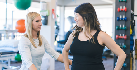 A female PT talking to a pregnant patient