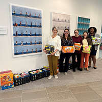 APTA pose with snacks collected for donation