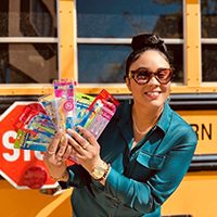 A woman fans new toothbrushes intended for donation