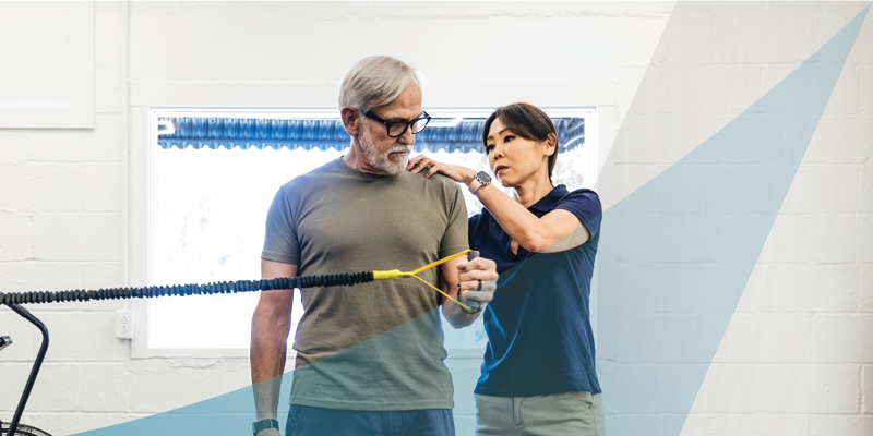 PT assisting a man with his shoulder