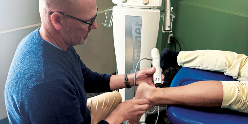 A PT uses a shockwave tool